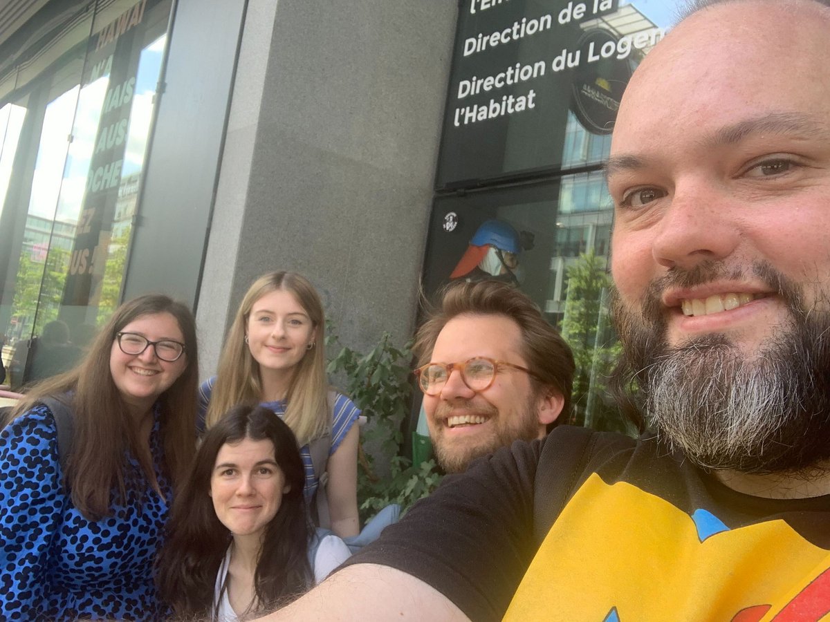 A smiley selfie taken of the team as in the first photo. George is larger in the frame on the right as the selfie-taker. Gemma, Molly, Raquel and Henri are huddled together, smiling.