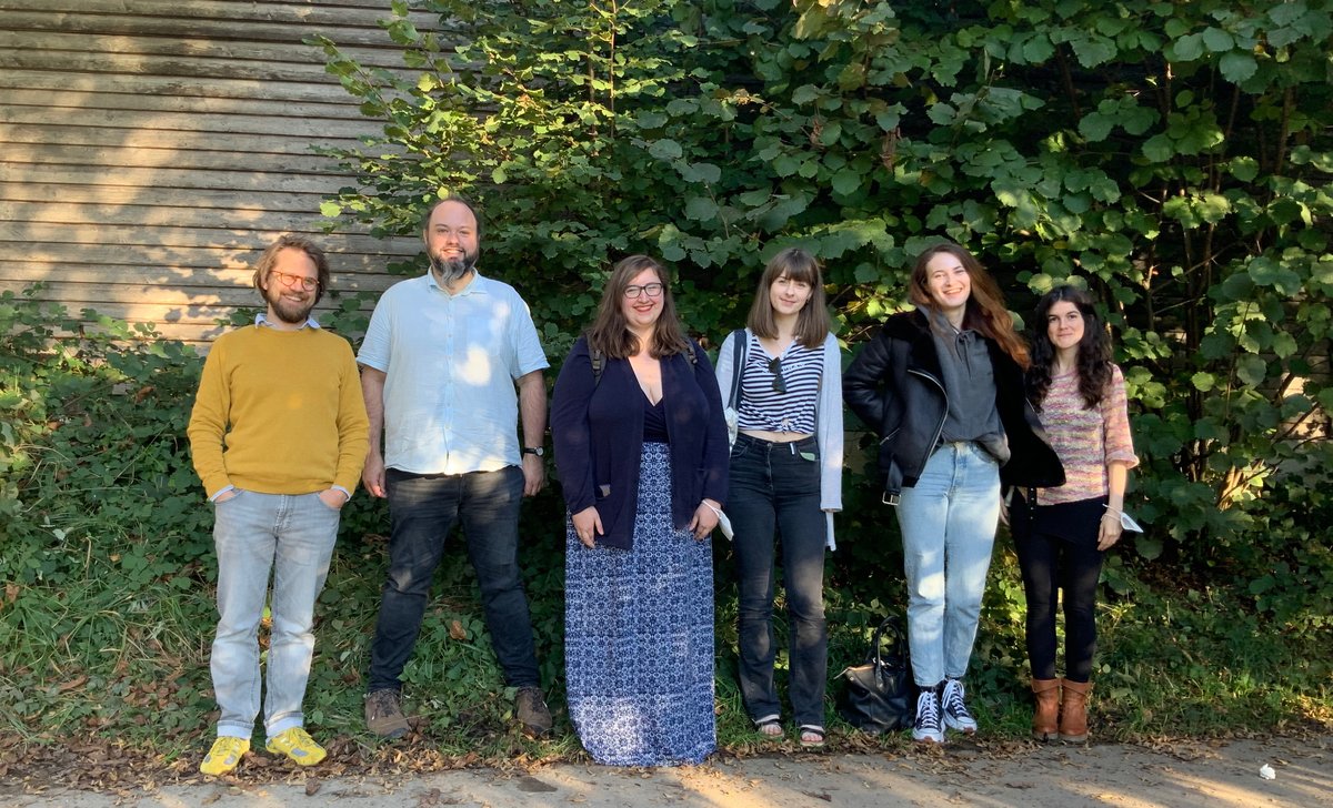 A group photo of the whole team standing in front of some foliage in Konstanz in the summer: Henri, George, Gemma, Molly, Sarah and Raquel